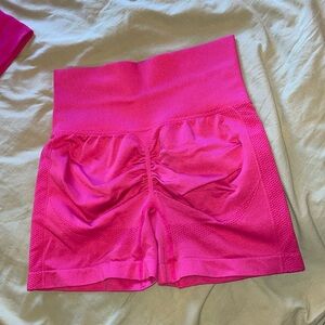 Hot pink scrunch workout shorts
